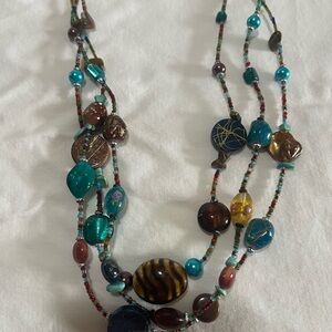 Turquoise and brown home made necklace. It has been worn but only a few times.